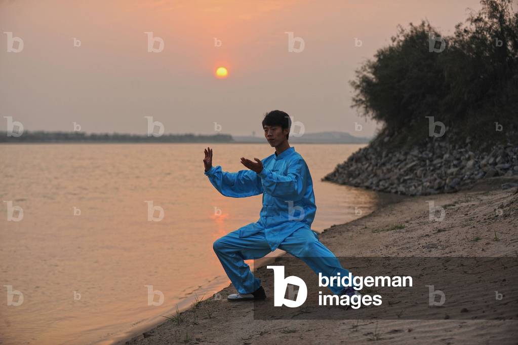 A man practices Taiji by the Yellow River at Chenjiagou Village in Wenxian County central China s H
