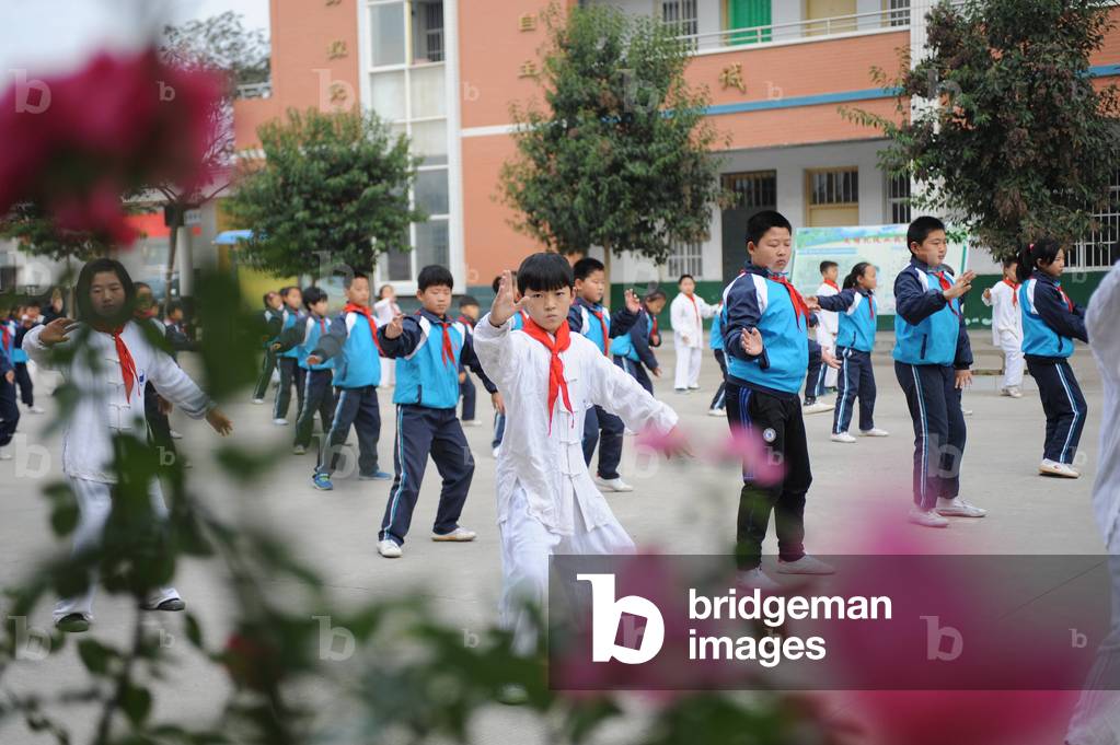 Pupils practice Taiji at the village school of Chenjiagou in Wenxian County central China s Henan P