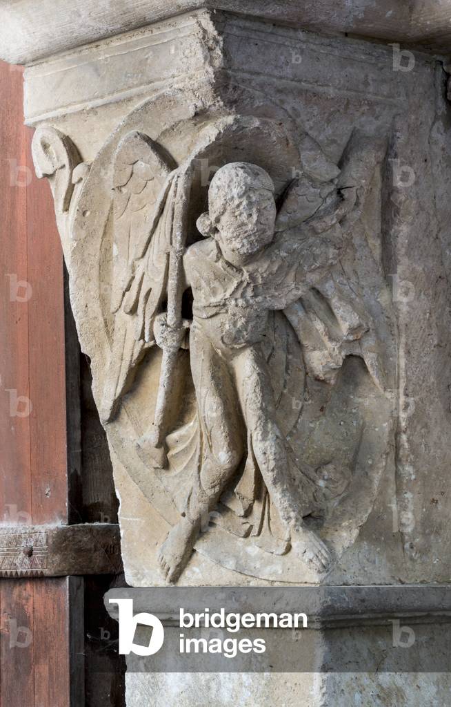 Angel fighting demons, 12th century (sculpture)