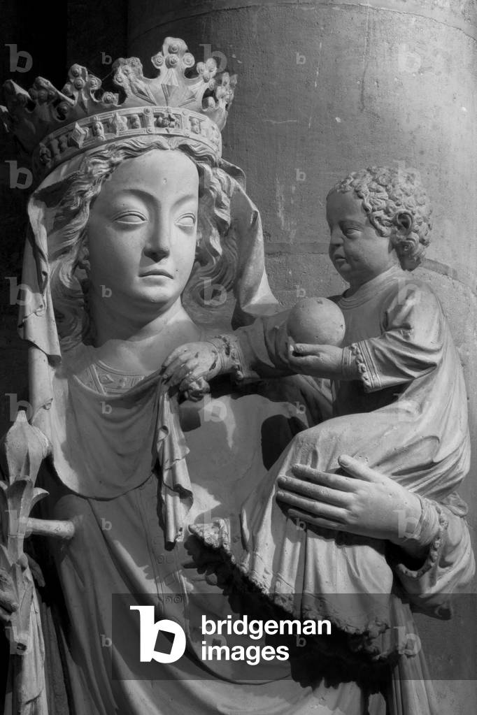 The Virgin of the 14th century placed at the entrance of the choir of Notre-Dame, known as the Virgin of Saint-Aignan or Our Lady of the Pillar, was originally located in the chapel of Saint-Aignan and replaced the statue of the trumeau of the portal of the Virgin (north facade) after its destruction in 1793. Viollet-le-Duc then installed it at its present location in 1855 at the time of the extensive restoration campaign of Notre-Dame. It was at his feet that Paul Claudel converted to Christmas 1886. Cathedrale Notre Dame de Paris - Paris 4 - XIIIth, XIIIth, XIXth, rehabilitation by Viollet-le-Duc -