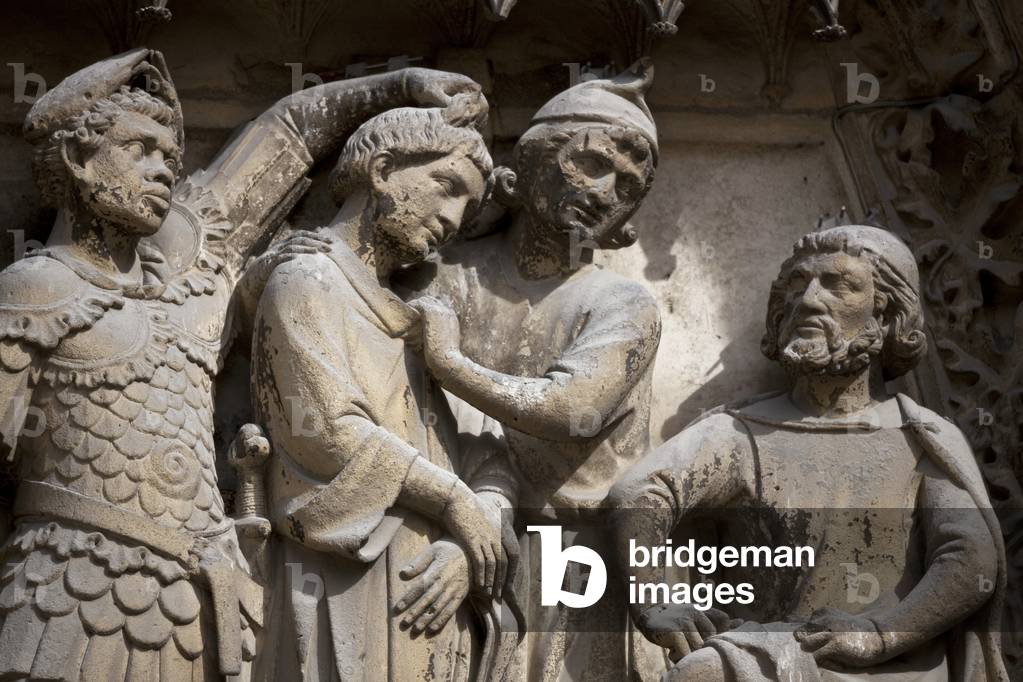Detail of the lower lintel of the eardrum of the Cathedrale Notre Dame de Paris: Saint Etienne, held by a Roman soldier of African origin, is taken to the Sanhedrin to be a judge. Cathedrale Notre Dame de Paris - Paris 4 - XIIIth, XIIIth, XIXth, rehabilitation by Viollet-le-Duc -