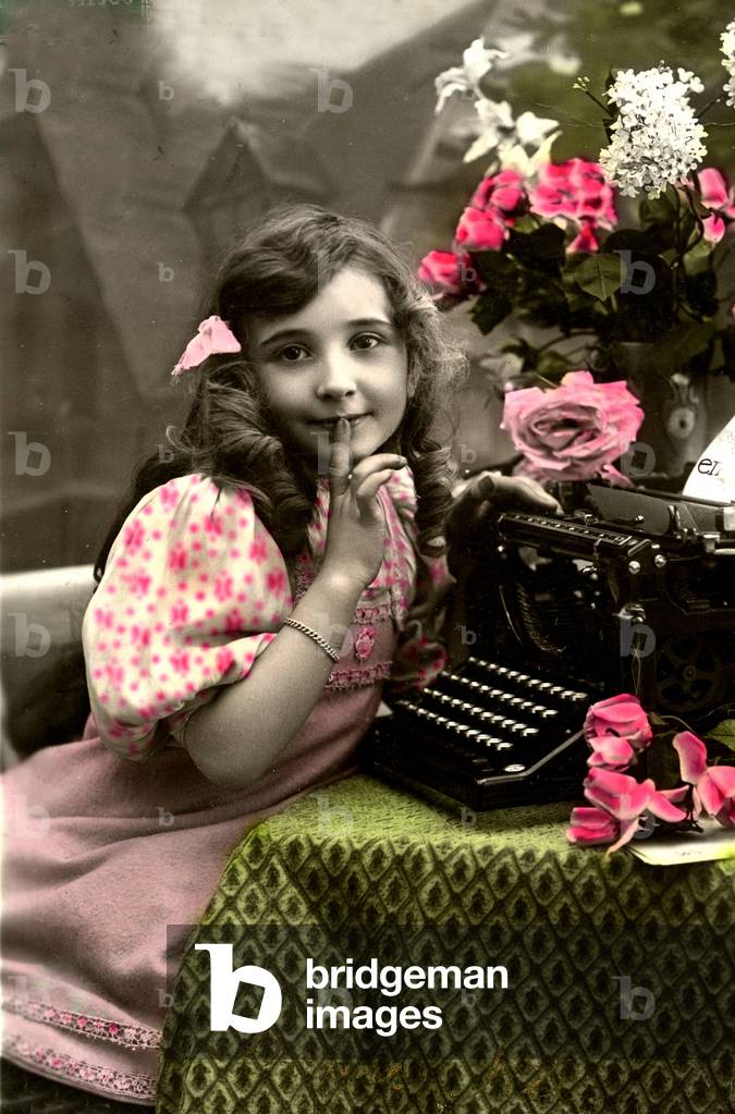 Postcard with portrait of little girl in front of a writing machine 1920