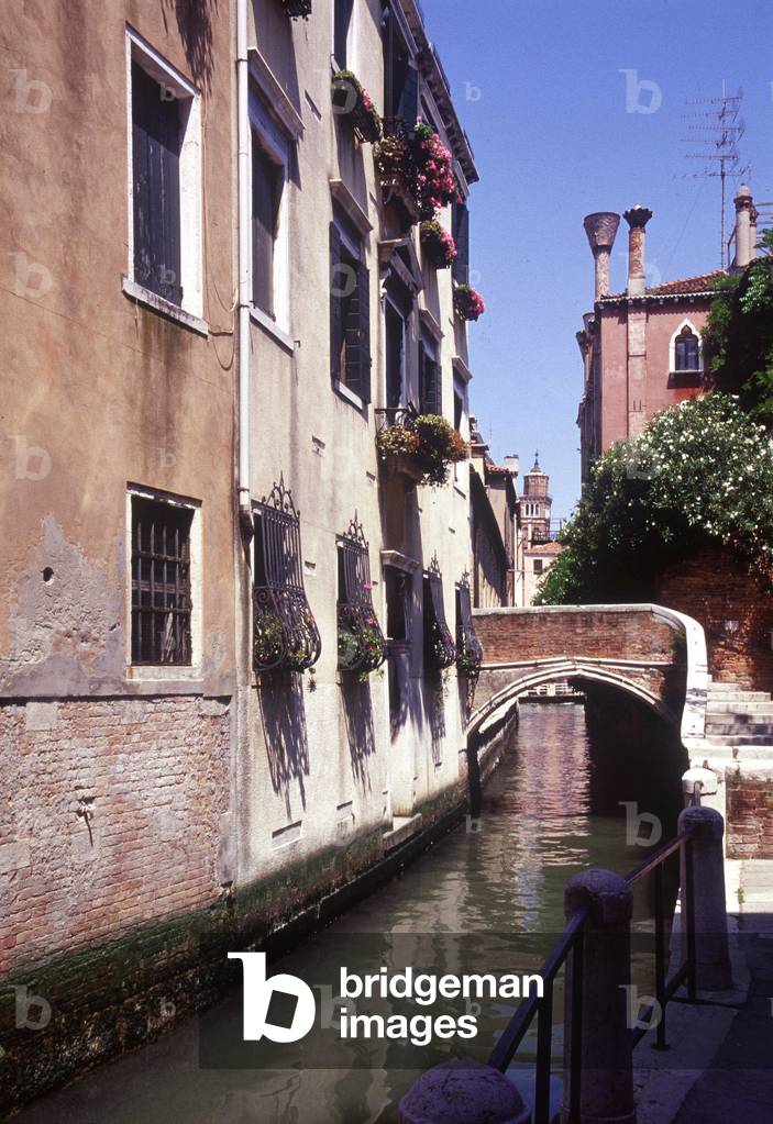 View of a small canal in Venice.