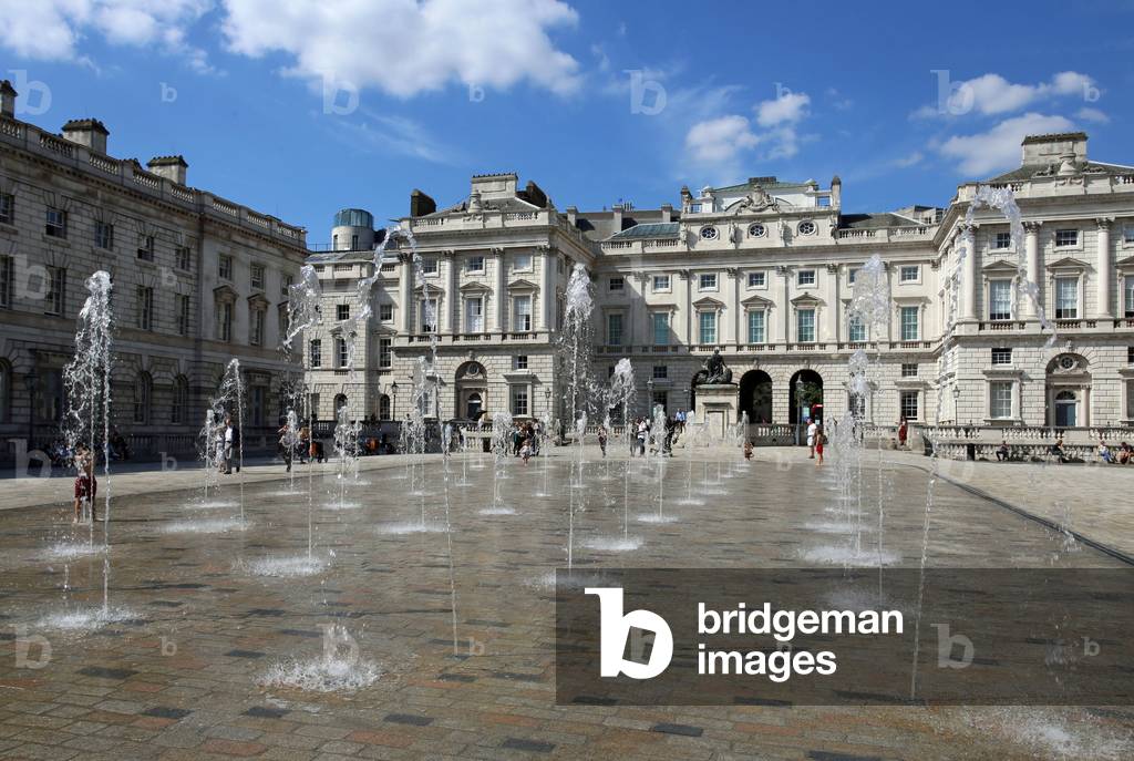 London, Somerset House. View over modern water-jets towards the N side of the courtyard.