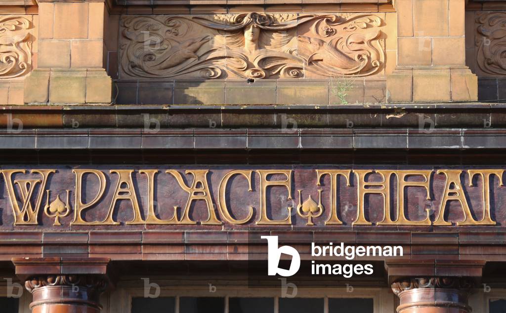 Terracotta panel showing girl's hair, and swimming dolphins, New Palace Theatre,  Plymouth (photo)