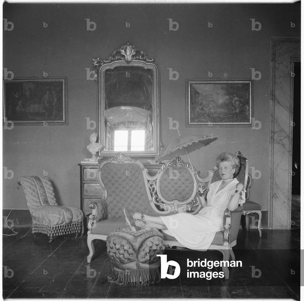 Caresse Crosby, portrait of American patron of the arts and inventer of first patented brassiere, in Castello di Rocca Sinibalda, Italy, mid 1950's (b/w photo)