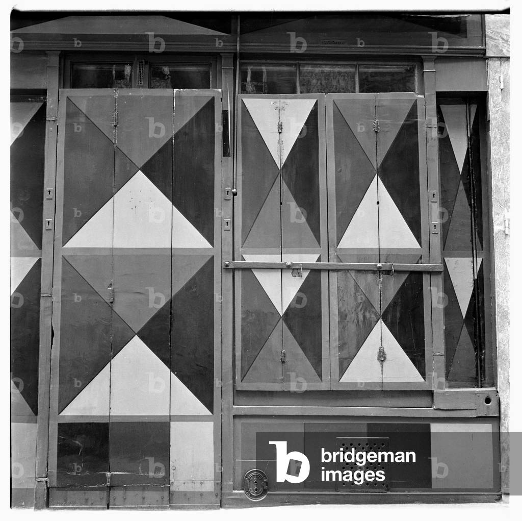 Image of geometeric harlequin pattern painted shopfront, Paris early early 1950's