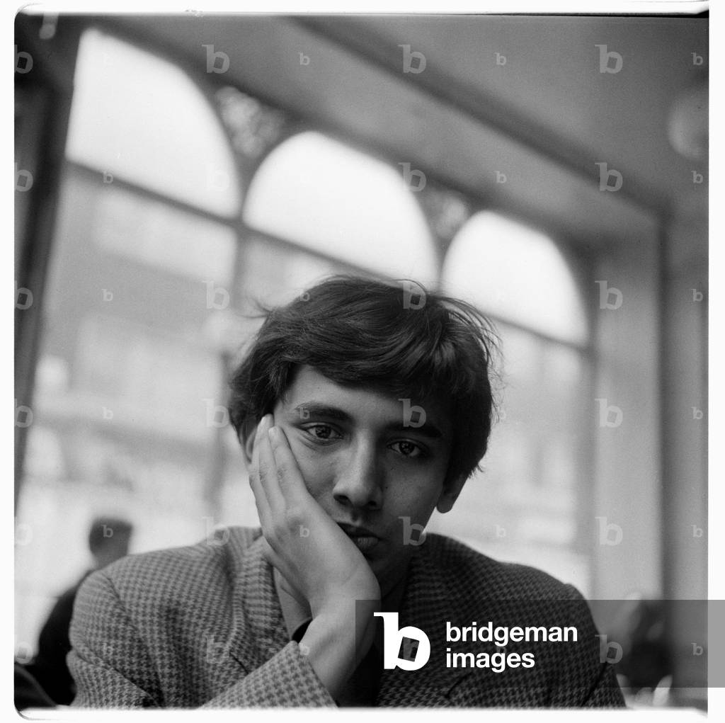 Portrait of poet Dom Moraes (b/w photo)
