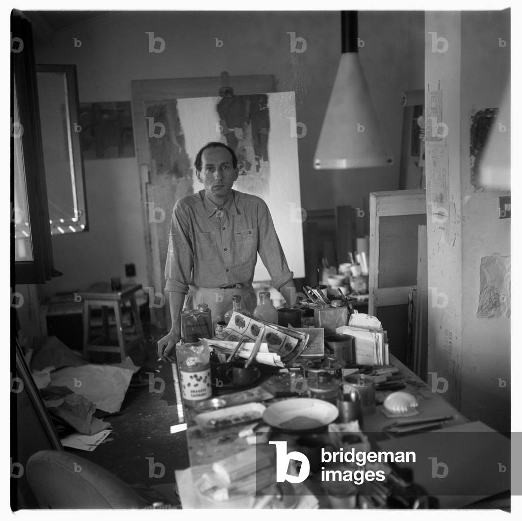 Portrait of Eugenio Carmi in his studio, possibly Rome, Italy, mid 1960's (b/w photo)