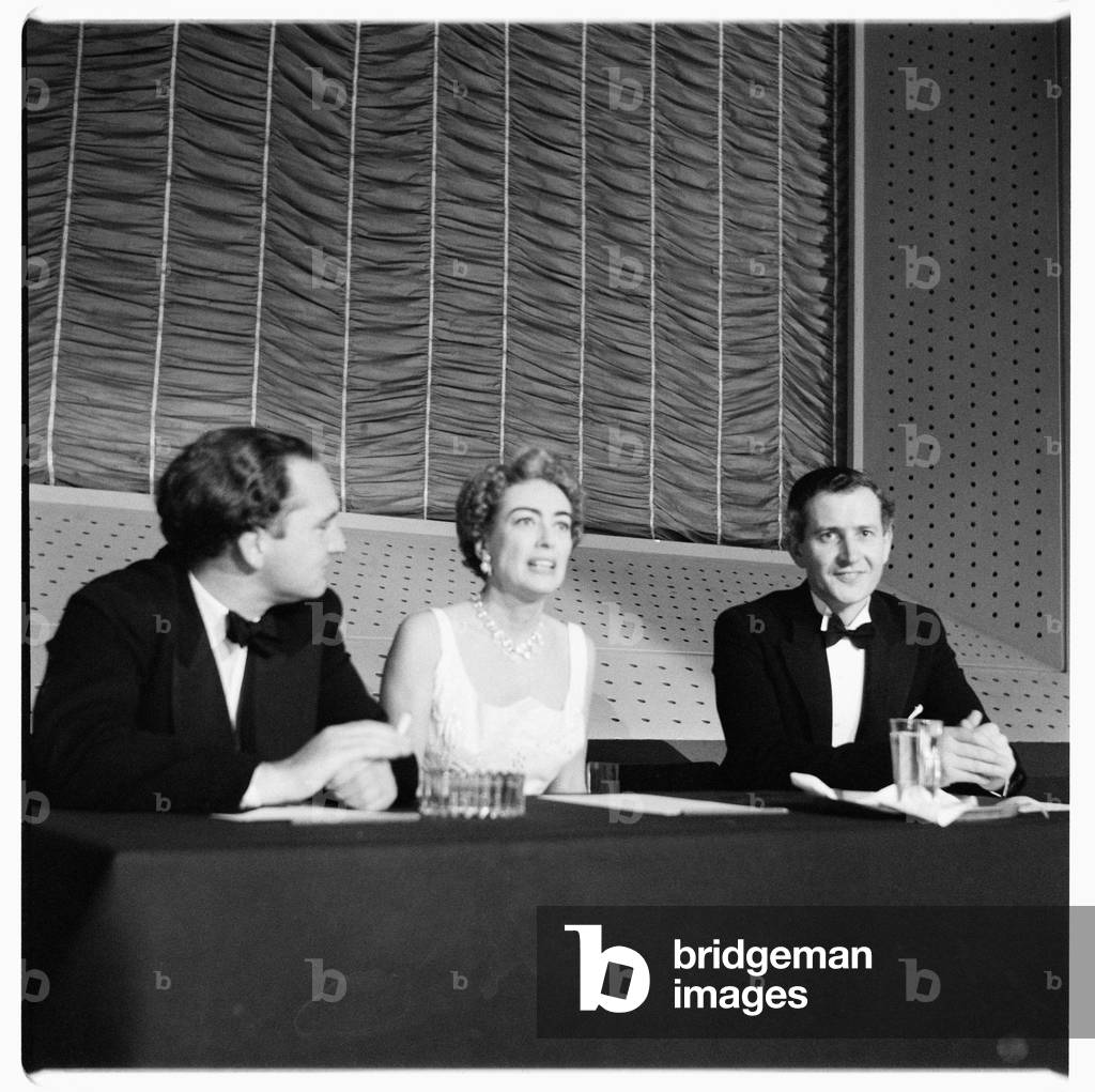 Joan Crawford (actress), portrait of Hollywood actress Joan Crawford at a press conference, London, UK, mid 1950's (b/w photo)