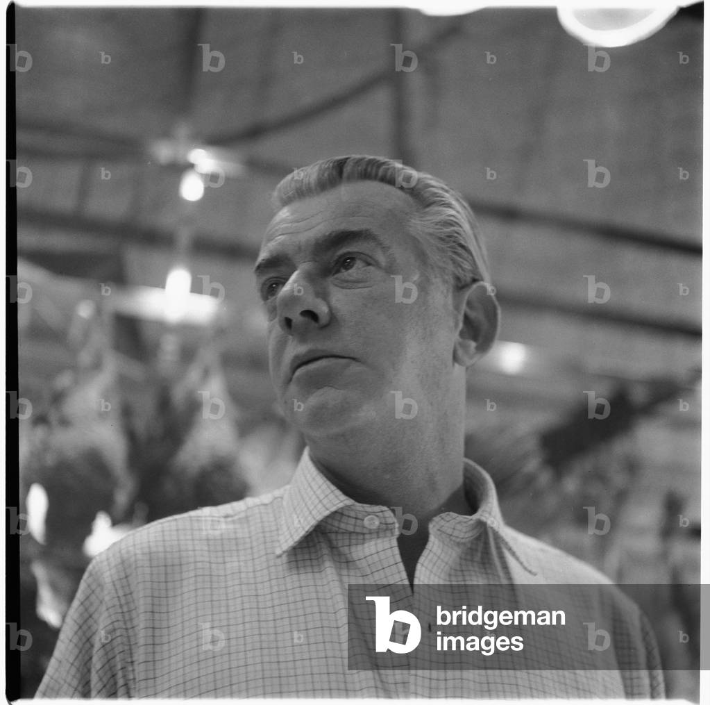 Peter Lacy, portrait of former WW2 fighter pilot, lover and model of Francis Bacon, Smithfirld meat market, London, UK, mid 1950's (b/w photo)