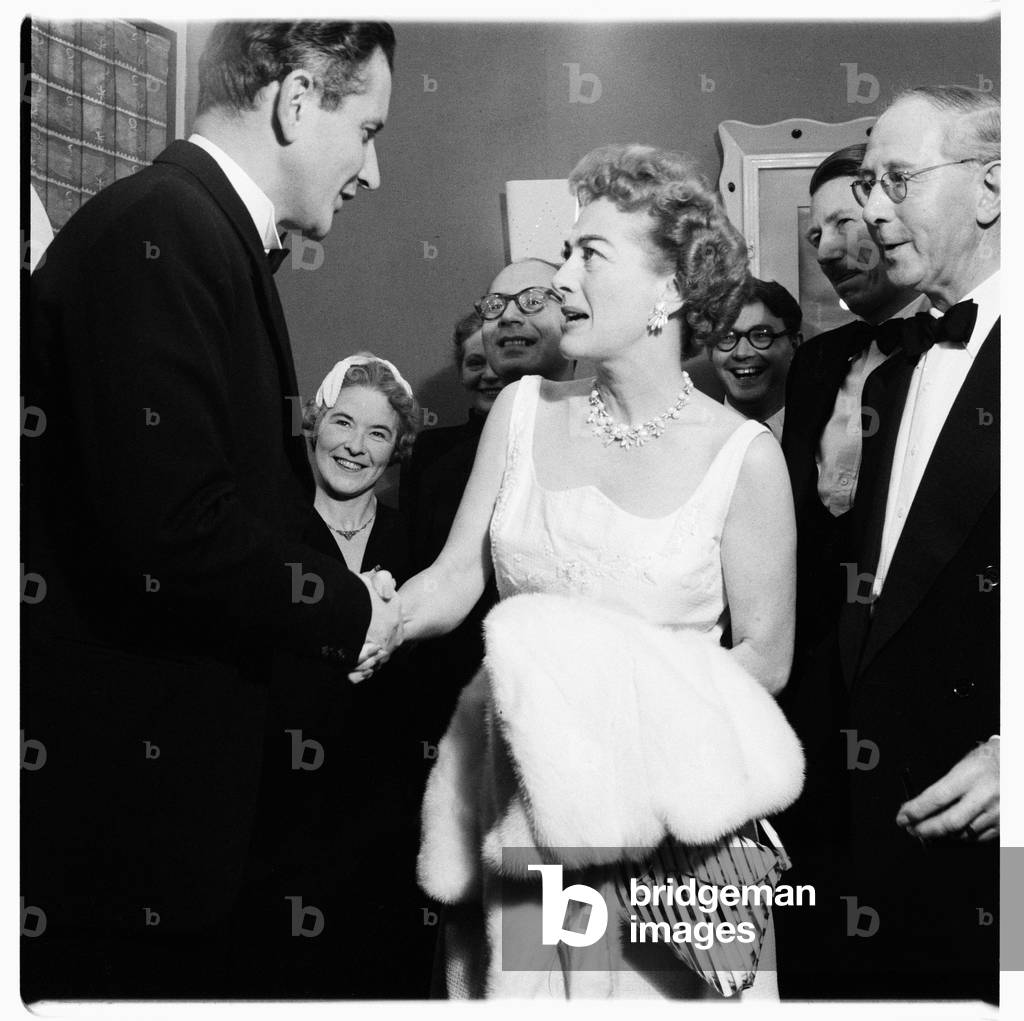 Joan Crawford (actress), portrait of Hollywood actress Joan Crawford at a press conference, London, UK, mid 1950's (b/w photo)