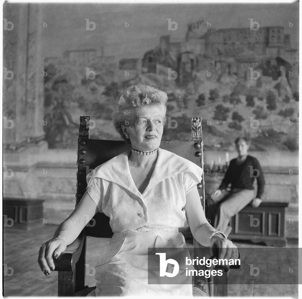 Caresse Crosby, portrait of American patron of the arts and inventer of first patented brassiere, in Castello di Rocca Sinibalda, Italy, mid 1950's (b/w photo)
