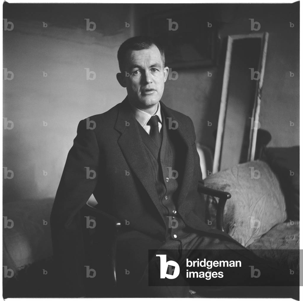 Colin McInnes, portrait of writer Colin McInnes in his home, London, UK, 1950's (b/w photo)