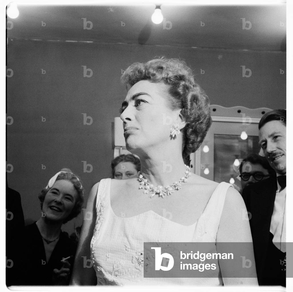 Joan Crawford (actress), portrait of Hollywood actress Joan Crawford at a press conference, London, UK, mid 1950's (b/w photo)