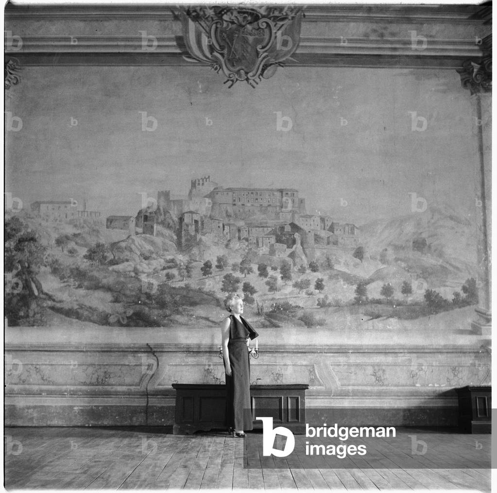 Caresse Crosby, portrait of American patron of the arts and inventer of first patented brassiere, in Castello di Rocca Sinibalda, Italy, mid 1950's (b/w photo)