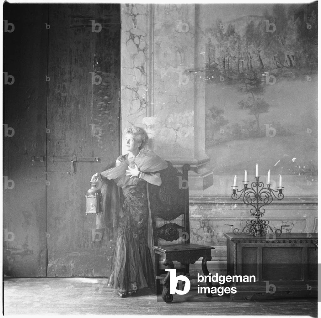 Caresse Crosby, portrait of American patron of the arts and inventer of first patented brassiere, in Castello di Rocca Sinibalda, Italy, mid 1950's (b/w photo)