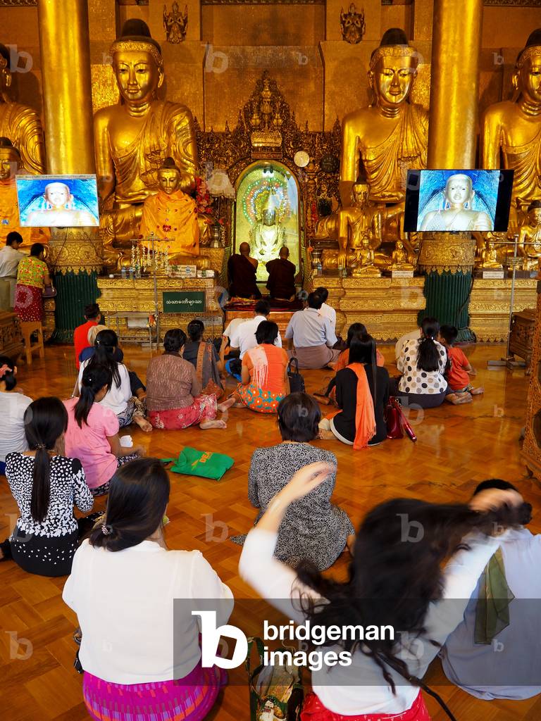 Myanmar - Burma: Yangon. Shwedagon Pagoda. Opened in 1372. Height 105 m. People in prayer and meditation