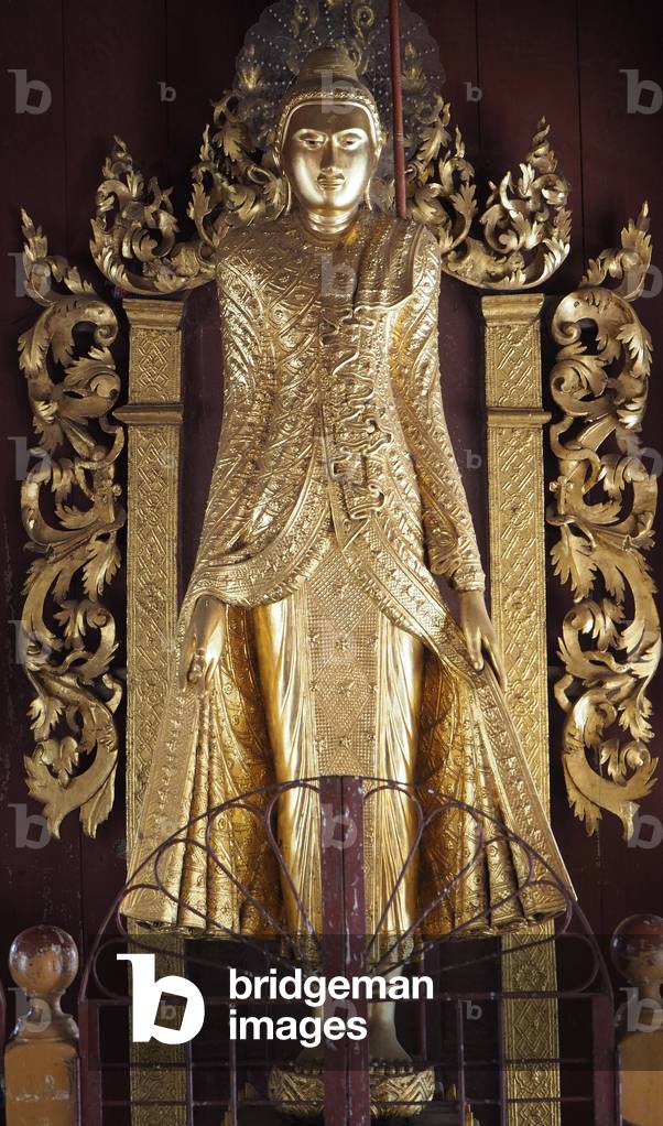 Myanmar - Burma: Bagan City, Shwe Zigon Zedi Pagoda, begins in 1059 completed in 1102. It houses a Buddha tooth. Representative of Buddha carved into a trunk of gilded teak