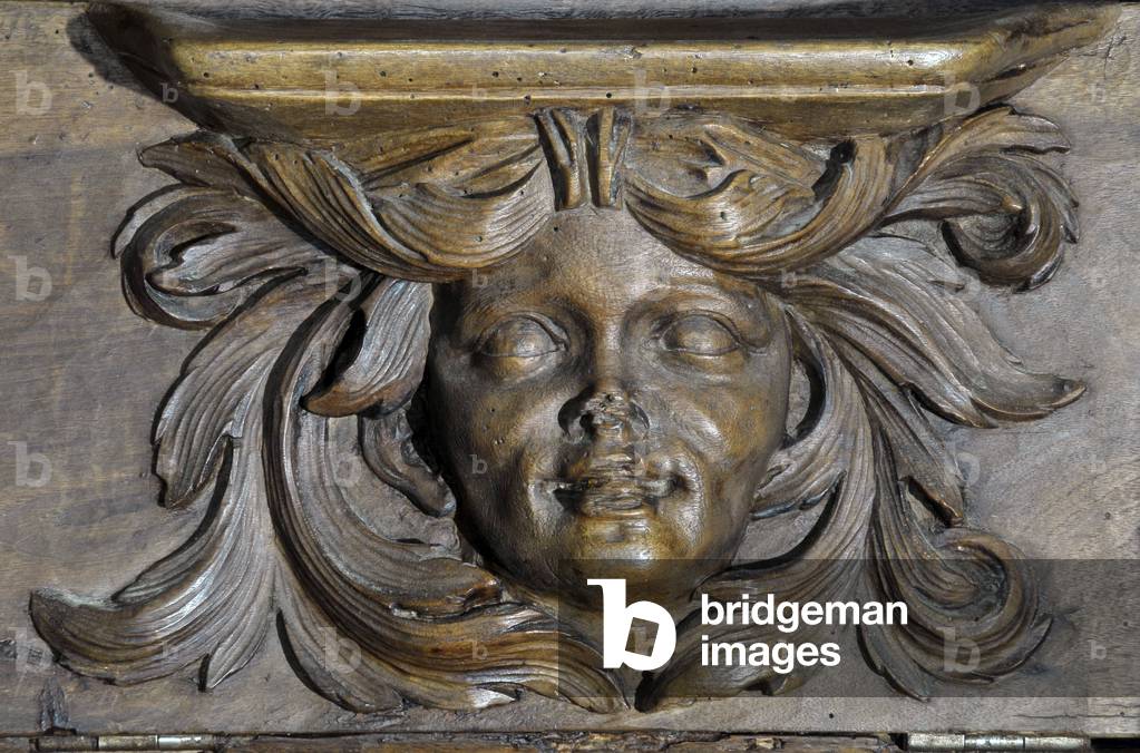 Woman's head Boiseries of the 17th century Detail of the stalls of the church of the Clunisian Prieure Sainte-Marie (Sainte Marie) founded in the 11th century, Moirax, Lot et Garonne