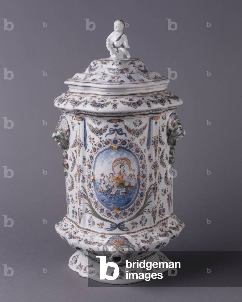Moustiers - Wall fountain with lid - “” Le Triomphe de la Godesse Amphitrite” - Decor with garlands and medallions, goat head mascarons - Faience stannifere, decoration of great fire polychrome - Musee de la Faience Marseille