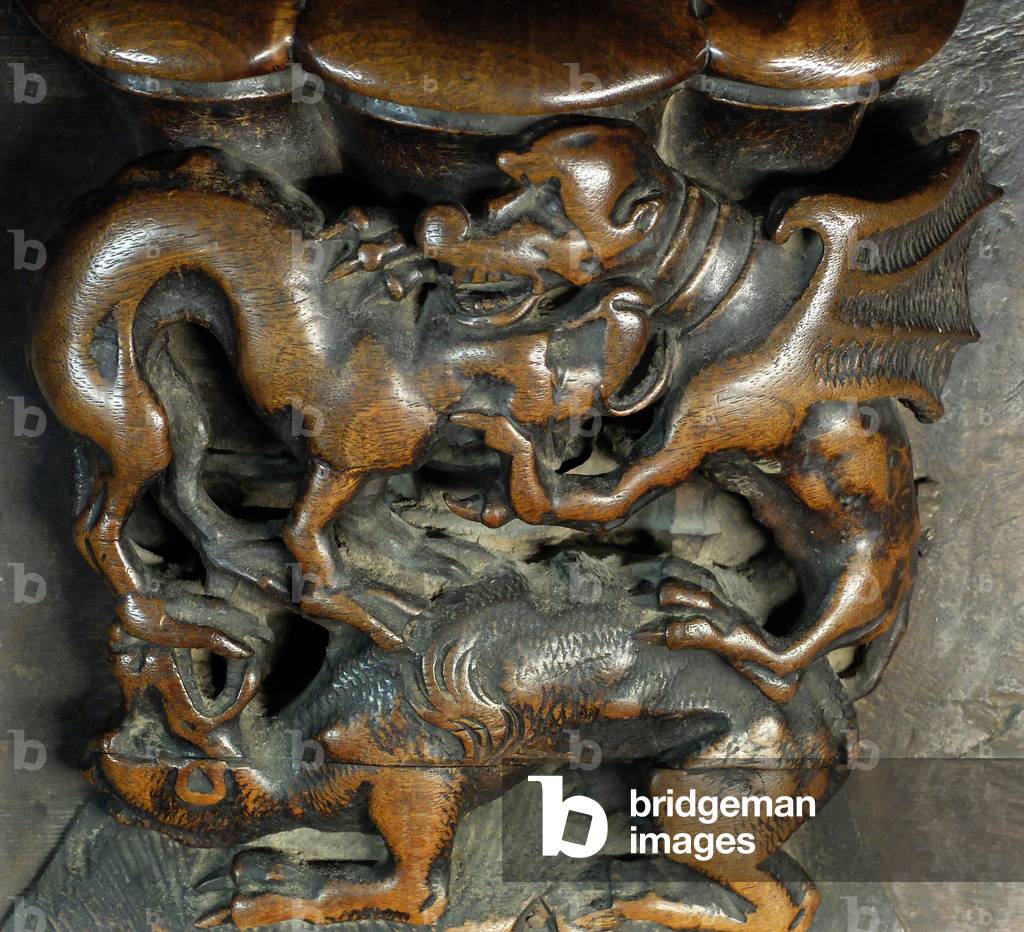 Tolede, Cathedrale Sainte Marie - Detail of the choir stalls representing a fight between a griffon and dogs - 15th century Spain