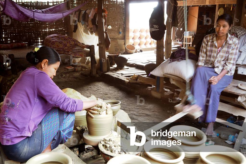 Myanmar - Burma: Potter Tower operates at two in Yandabo village, pottery village
