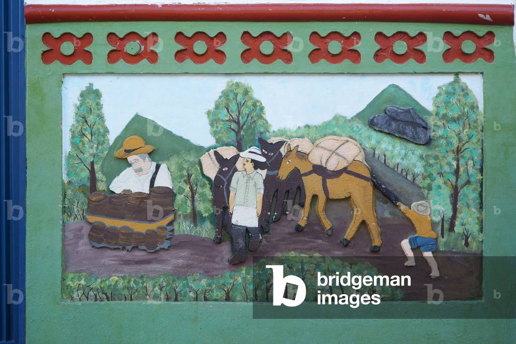 House painted and decorated, bas-reliefs “Zocales”, detail, Guatape, Colombia (photo)