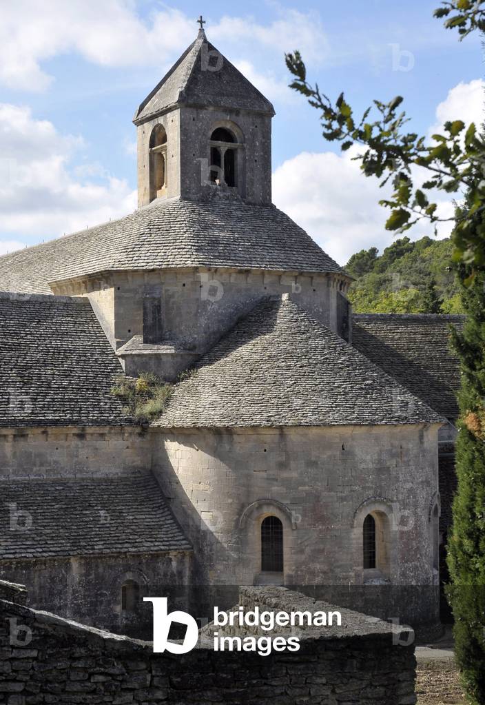 Cistercian Romanesque Art: View of the bedside of the Abbey of Notre-Dame (or Notre Dame) from Senanque to Gordes. Primitive Cistercian architecture of the 12th century. Abbey still in activity, created in 1148 by the eveque of Cavaillon, Alphant (or Alsaur). Vaucluse, Provence-Alpes-Cote d'Azur (Provence Alpes Cote d'Azur), France. Photography 2011