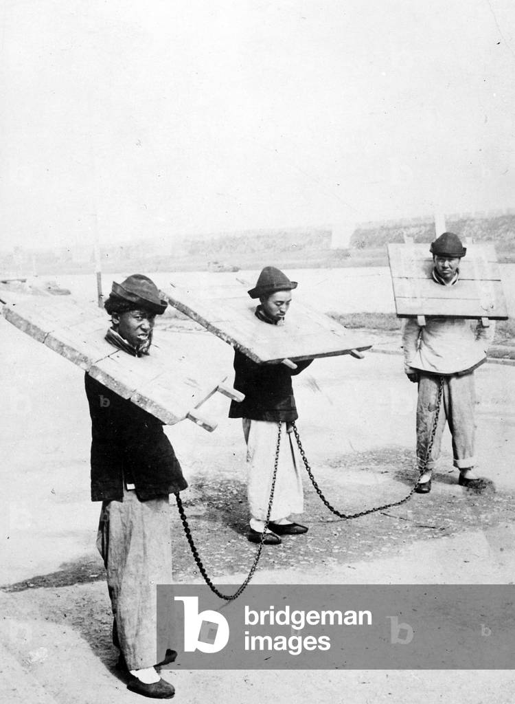 Chinese Prisoners wearing Cangues, early C20th (b/w photo)