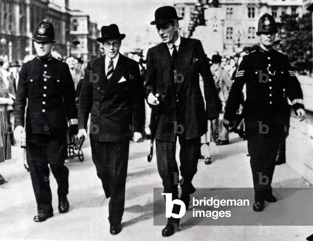 Edward Wood or Lord Halifax (1881-1959) on a walk escorted by two policemen, September 1939 (photo)