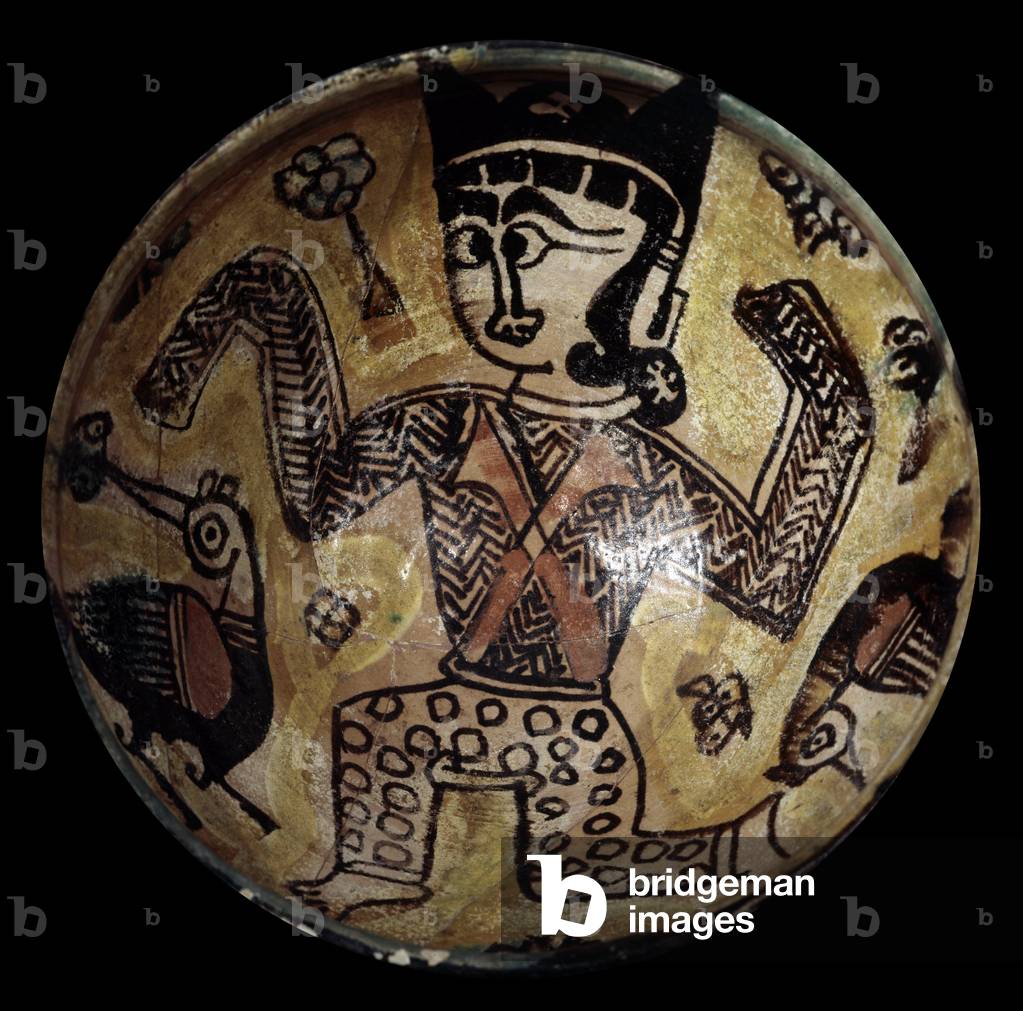 Persian art: Enalelled terracotta cut decorated with a character with two birds (terracotta)