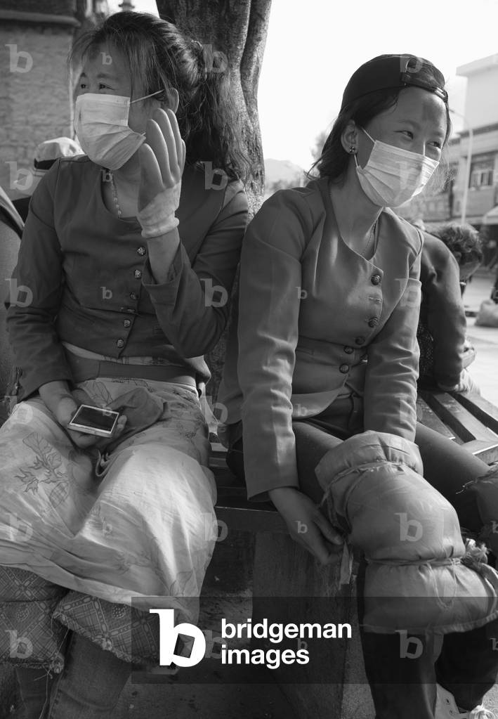 Two young women making pilgrimage, Lhasa, Tibet (b/w photo)