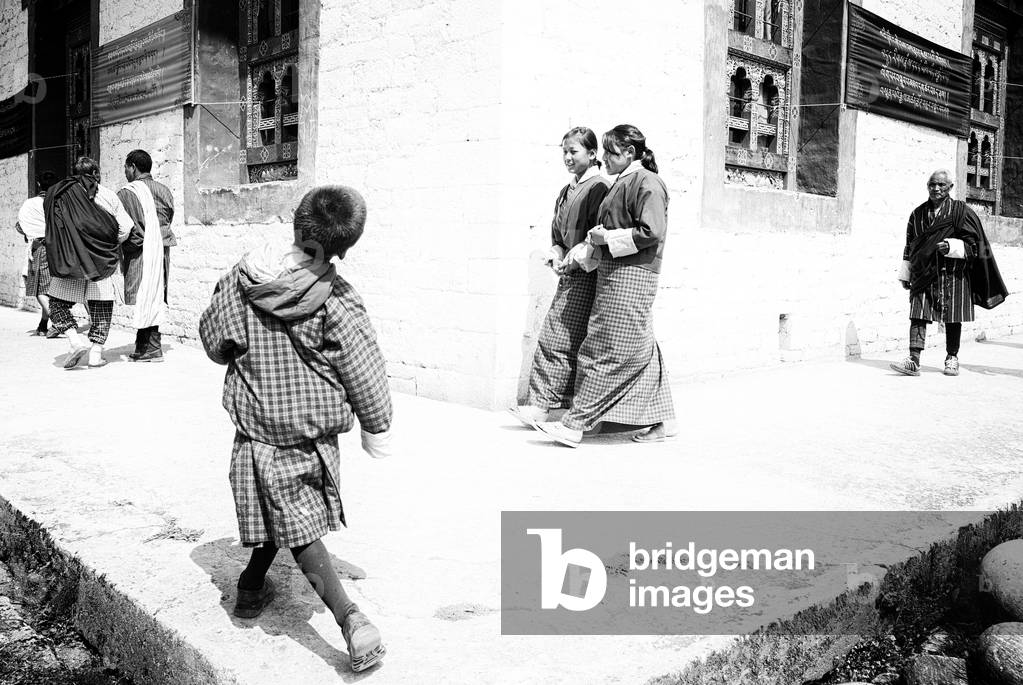Gathering outside monastery, Bhutan (b/w photo)