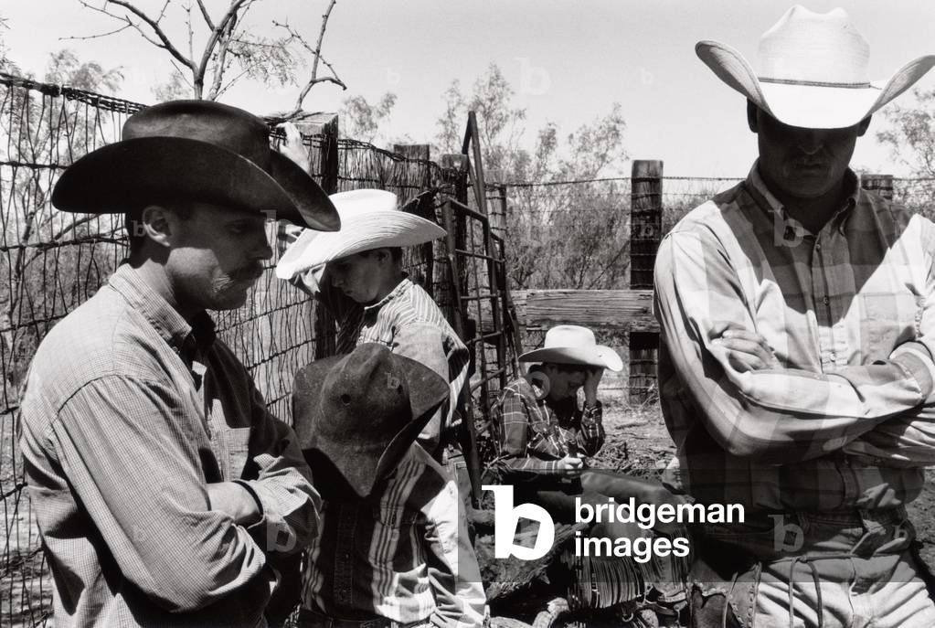 Cowboys and kids taking a break on the JA Ranch North Texas, USA (b/w photo)