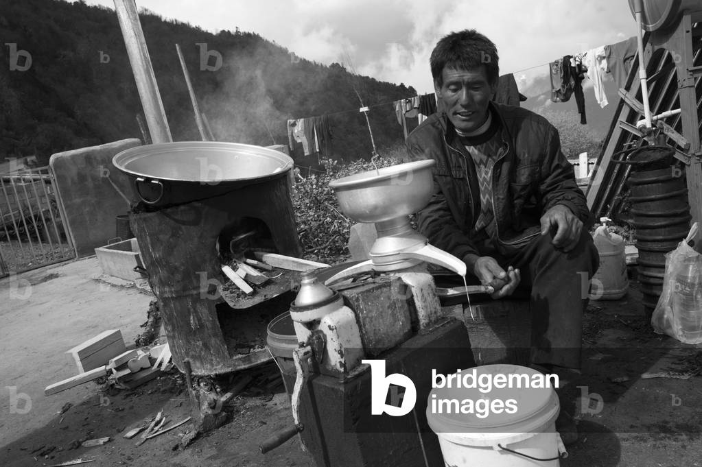 Yunnan farmer making milk (b/w photo)