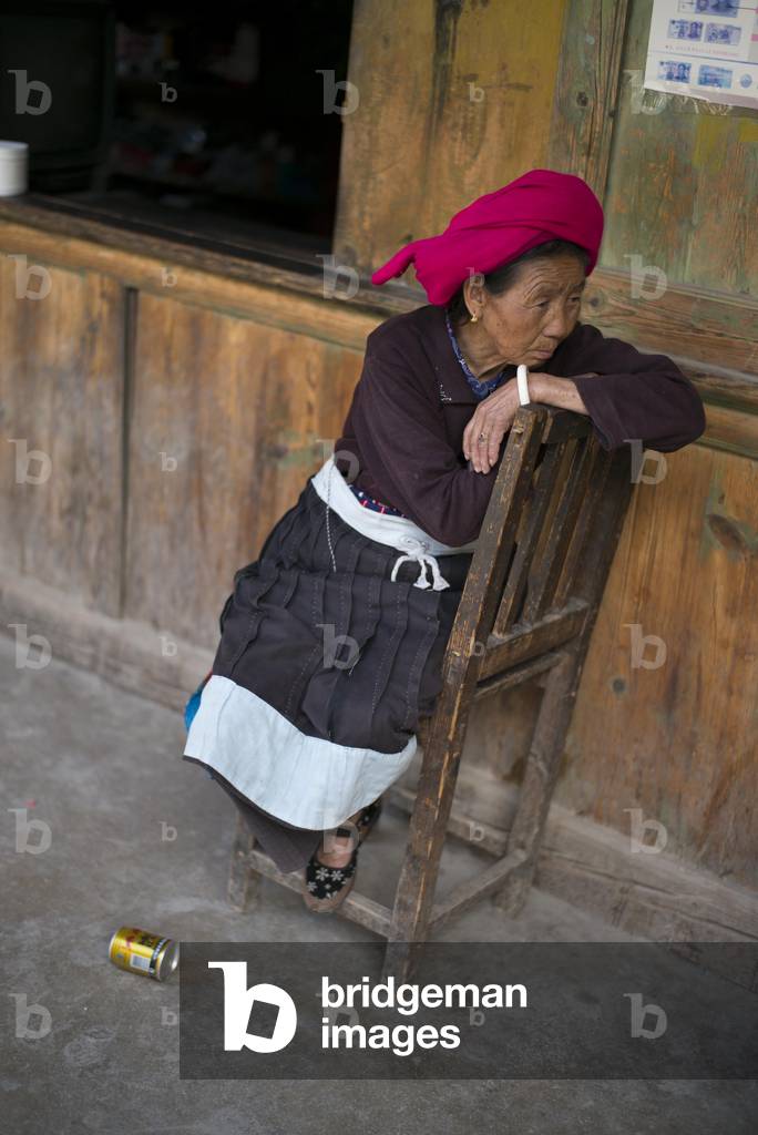Yunnan Women on porch, China (photo)