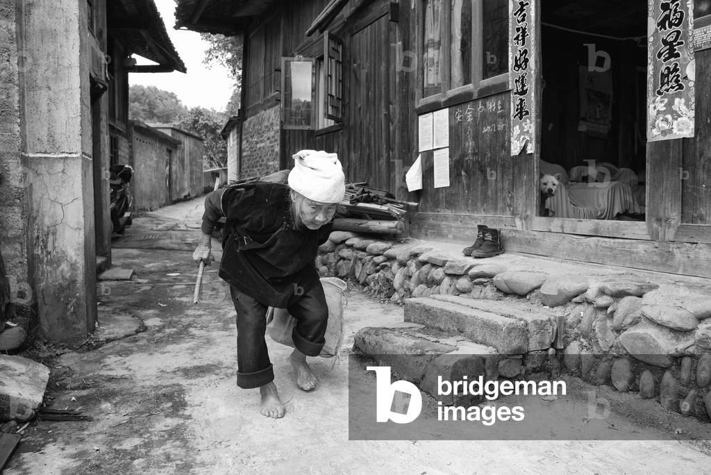Old Lady walks the streets, Nr Yibin, China (b/w photo)