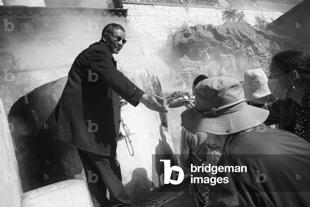 Pilgrims present offerings, Lhasa, Tibet (b/w photo)