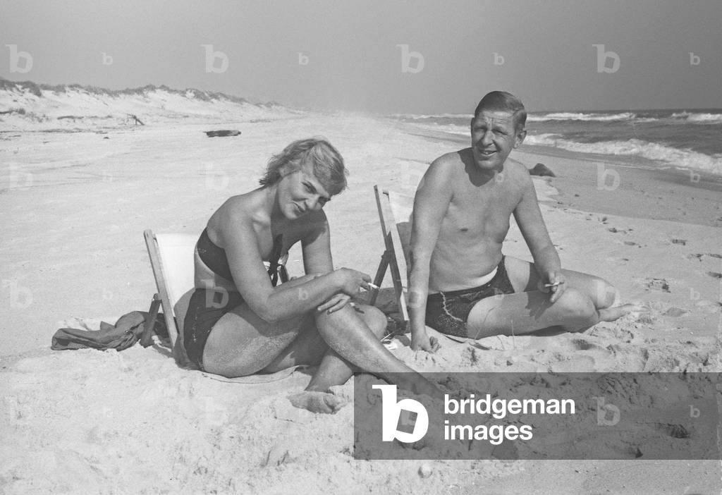 W.H. Auden and Rhoda Jaffe at the beach, Fire Island, New York, Summer 1946 (b/w photo)
