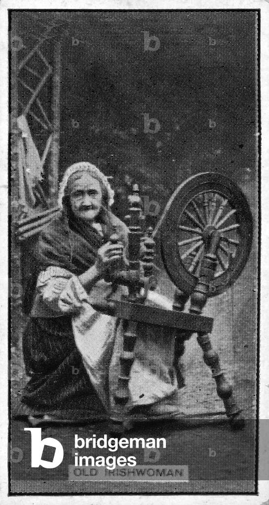 Elderly Irish woman at her spinning wheel, from a late 19th century photograph (litho)