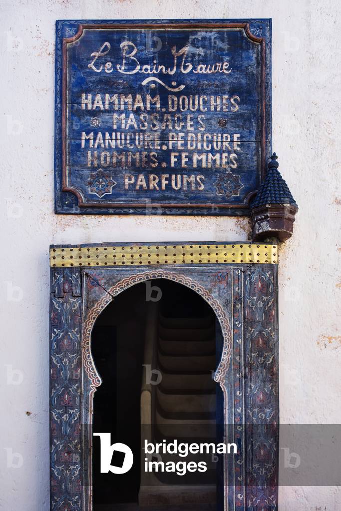 Blue arched doorway and sign, Le Jardin des Biehn, Fes Morocco (photo)