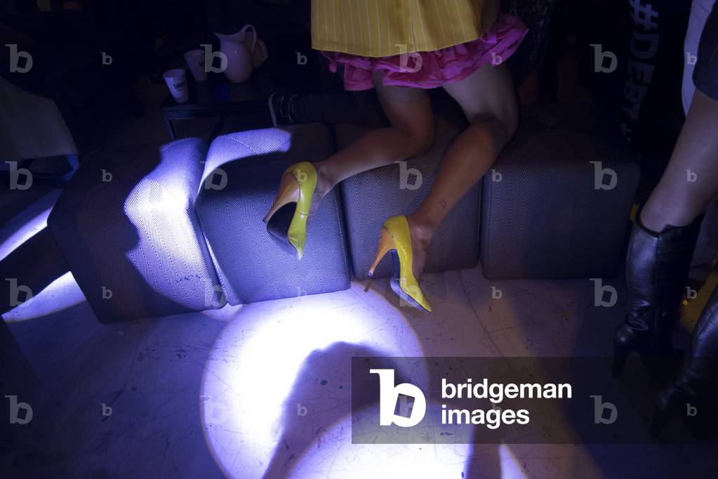 Women's legs and high heels at party, Mexico City