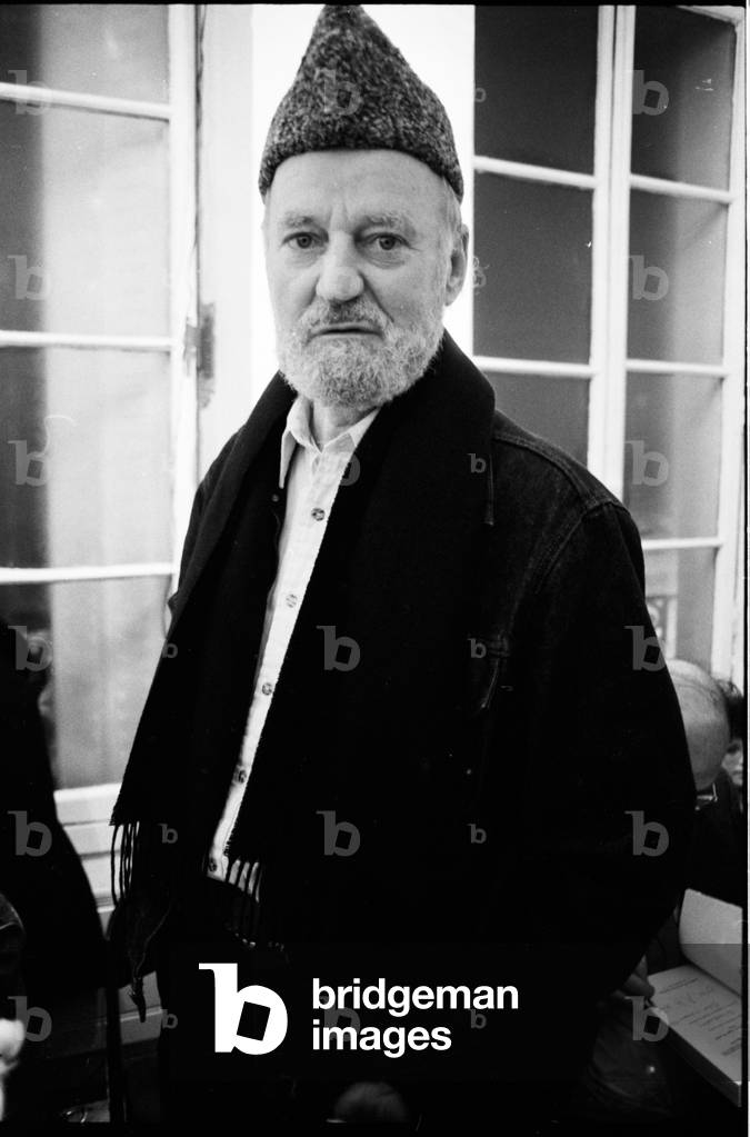 Lawrence Ferlinghetti at library Village Voice, Paris, France, 1982 (b/w photo)