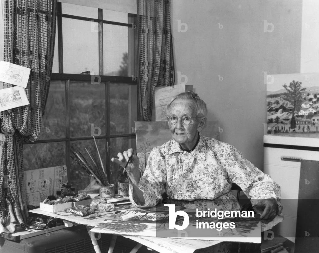 Grandma Moses Painting in the Room Behind her Kitchen, 1952 (b/w photo)