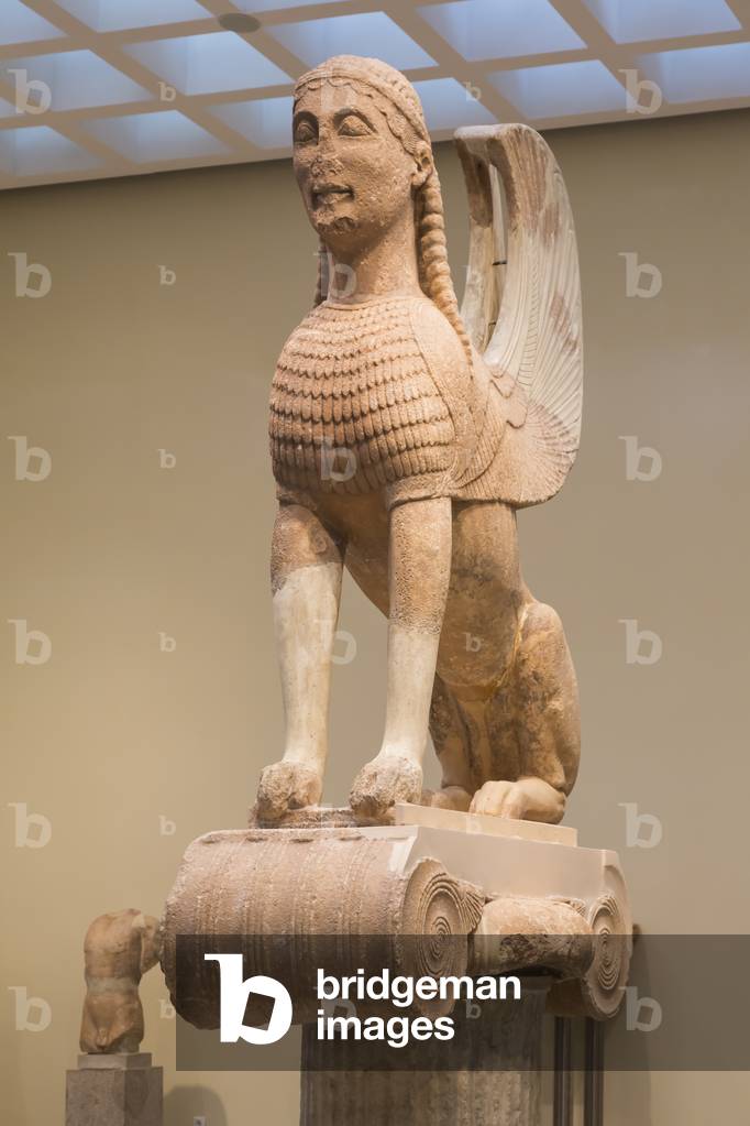 Delphi, Phocis, Greece.  Delphi Archaeological museum.  Sphinx from the Naxian Column, dating from around 570-560 BC.
