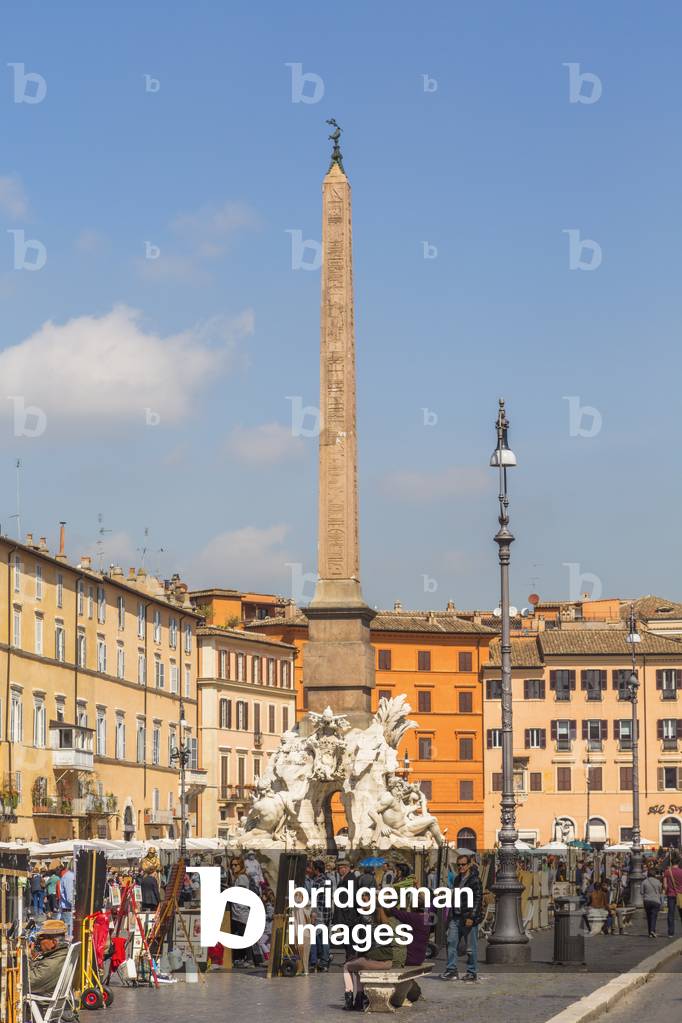 Rome, Italy.  Piazza Navona.  The obelisk of Domitian rising above the Fontana dei Quattro Fiumi, or Fountain of the Four Rivers (photo)