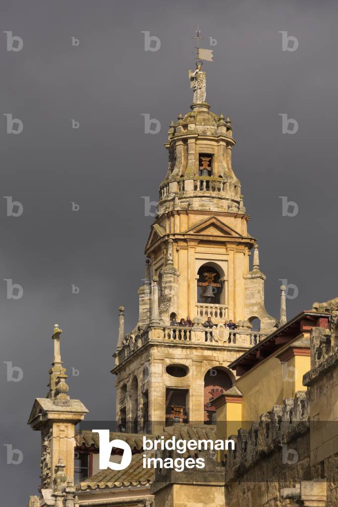 Cordoba, Cordoba Province, Andalusia, southern Spain.  The Alminar bell tower of the Cordoba mosque against a stormy sky (photo)