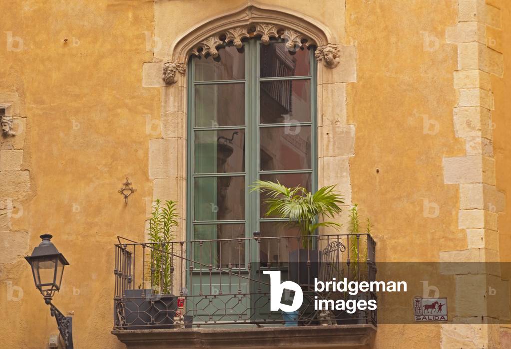 Barcelona, Spain.  Window and balcony in Gothic Quarter.  Architectural detail.