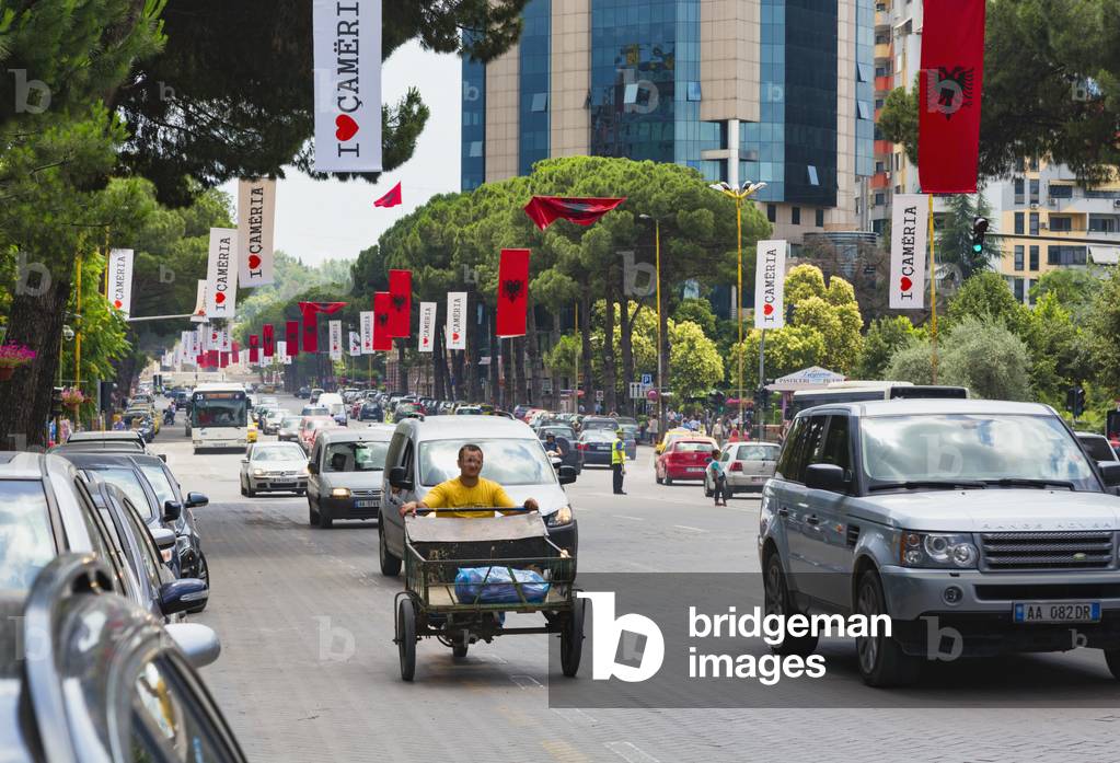 Traffic on Dëshmorët e Kombit Boulevard or Martyrs of the Nation Boulevard, one of the capital's main thoroughfares, Tirana, Albania (photo)